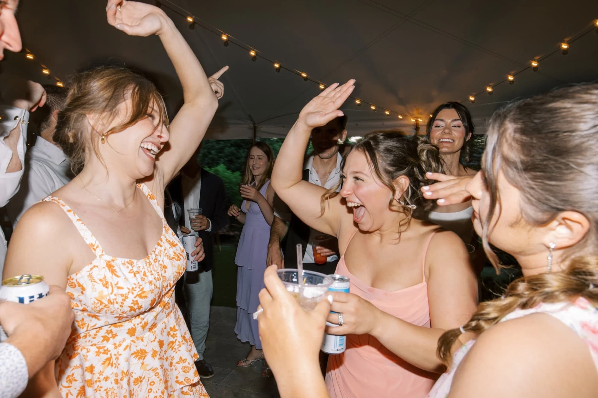 Guests laughing on the dance floor at Cypress House