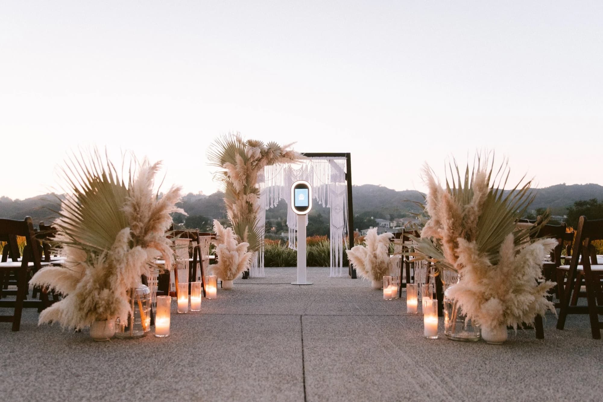 Lyric booth set up on a rooftop terrace at sunset