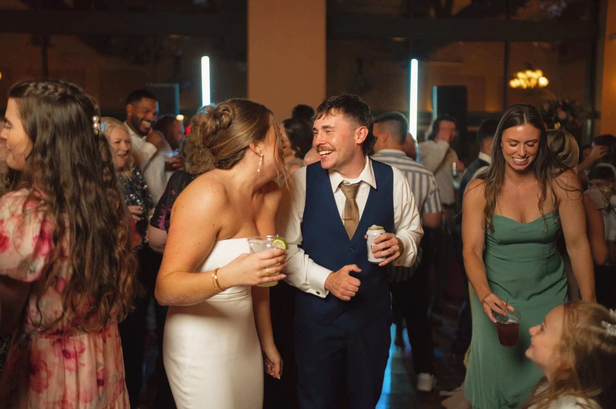 Couple surrounded by guests on the dance floor