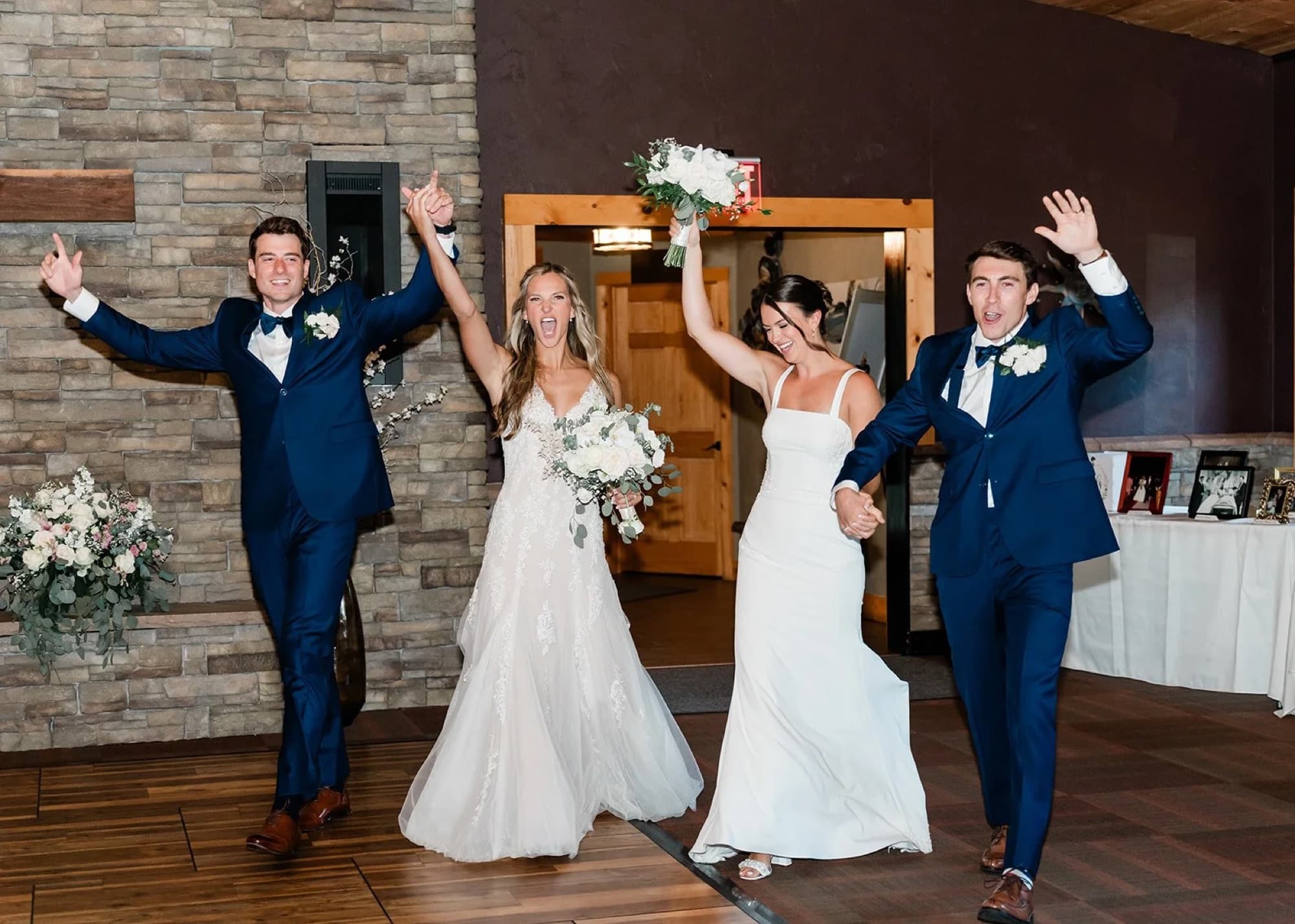 Two couples making their reception entrance at Whispering Hollow