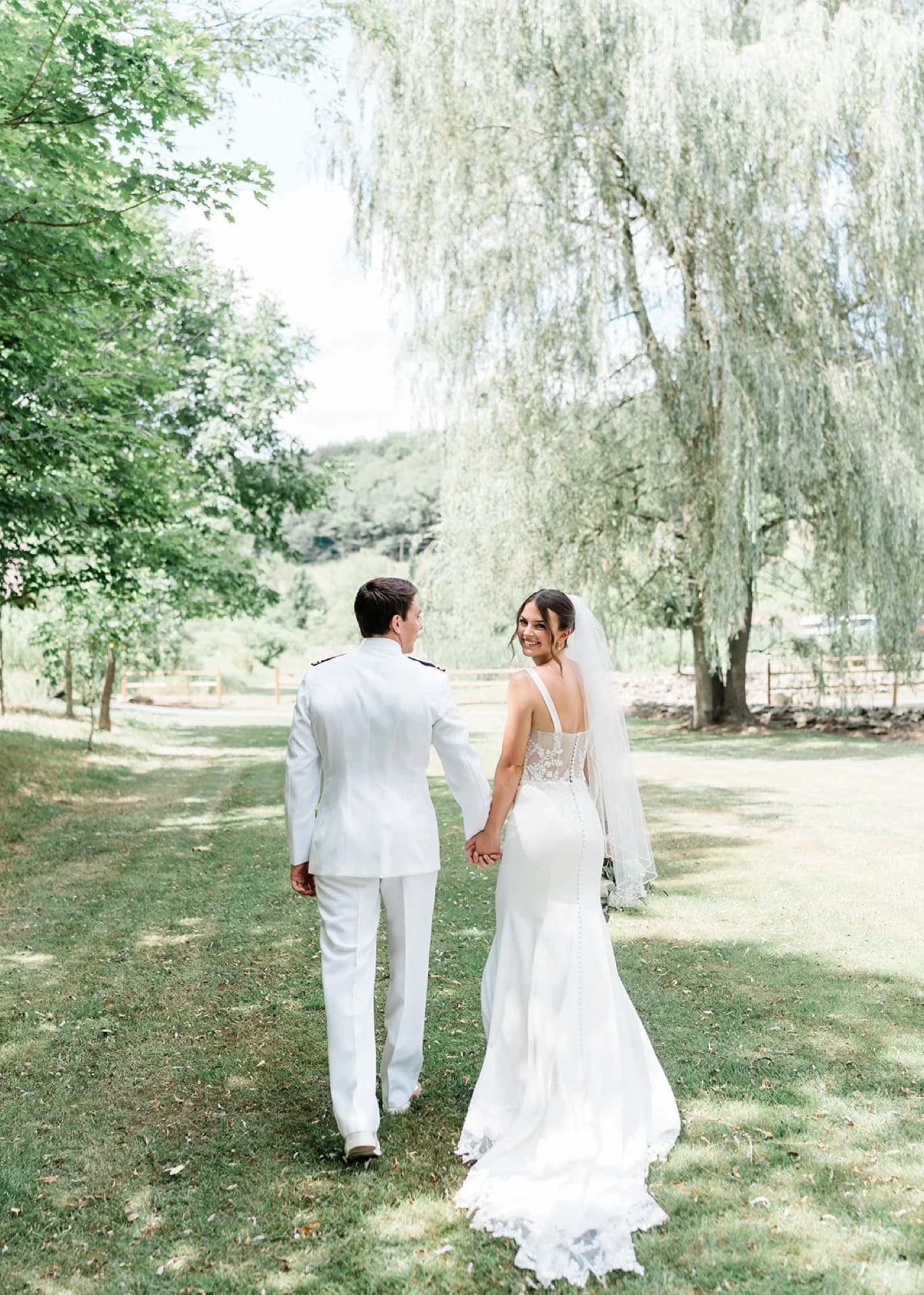 Couple walking the grounds at Whispering Hollow Estate