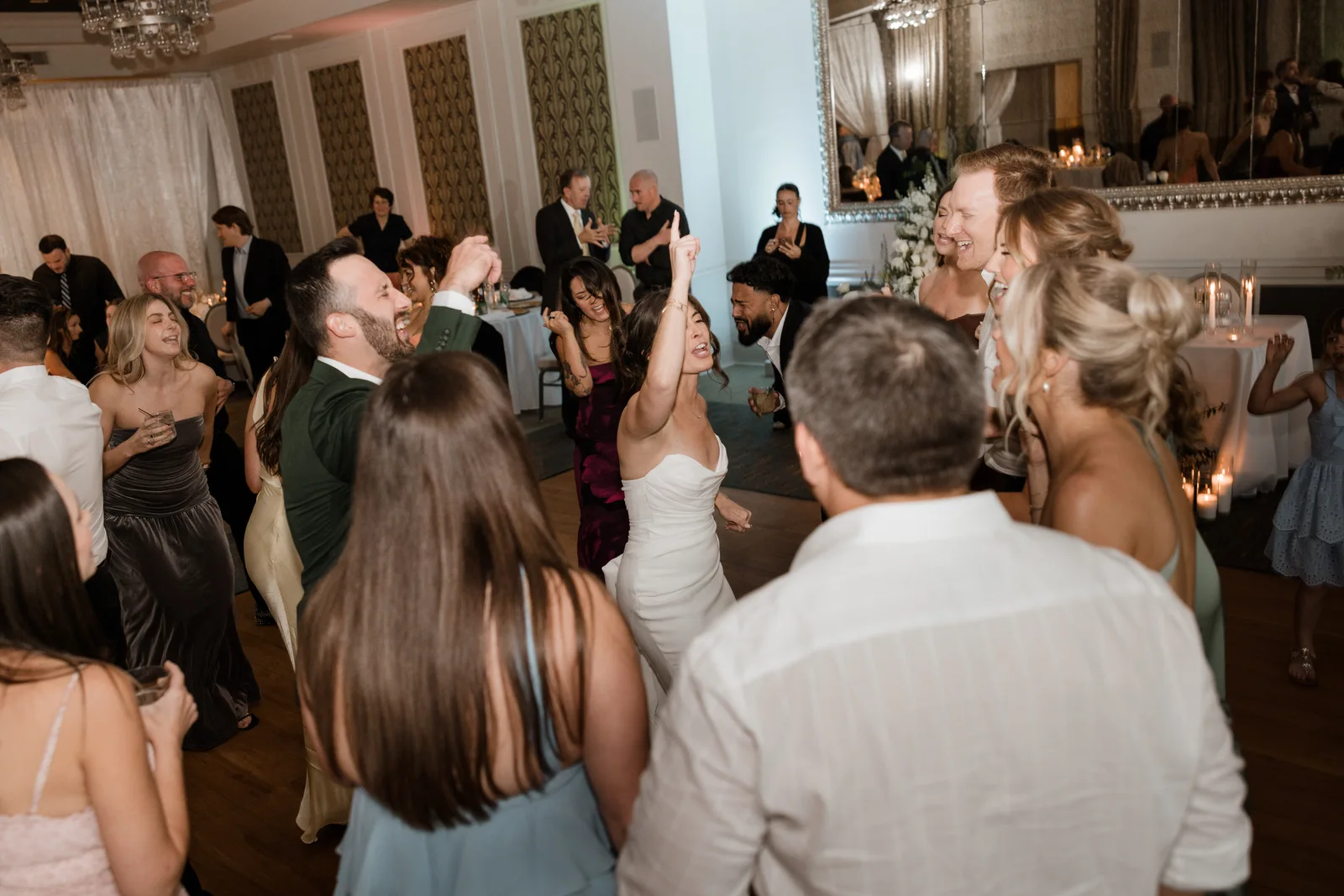 Bride and guests singing on the dance floor at The Birchwood